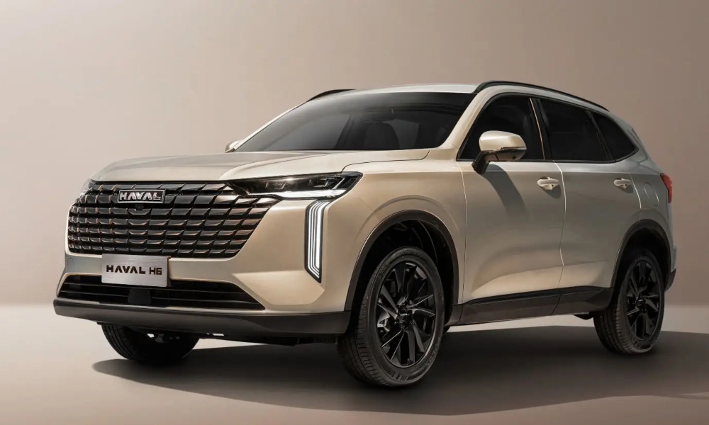 SUV hÃbrida Haval H6 HEV color dorado con rines de lujo y diseño futurista.